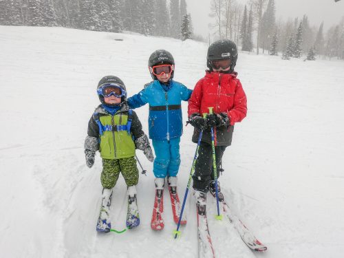 little boys skiing together