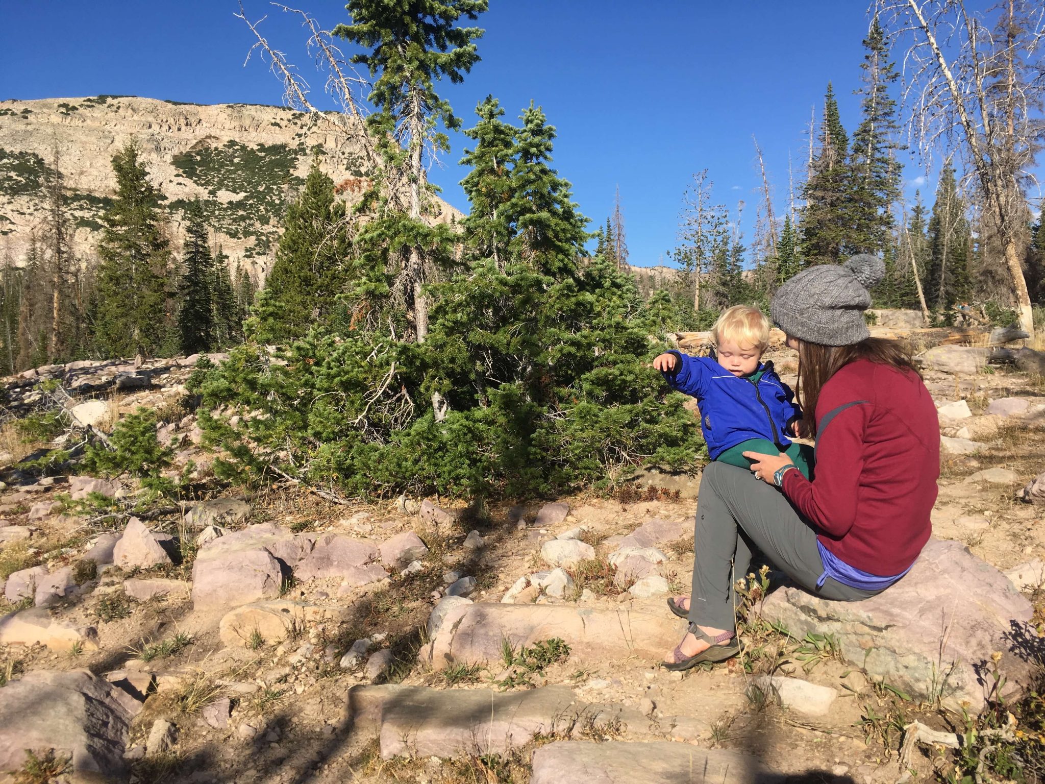mom and baby camping in the mountains