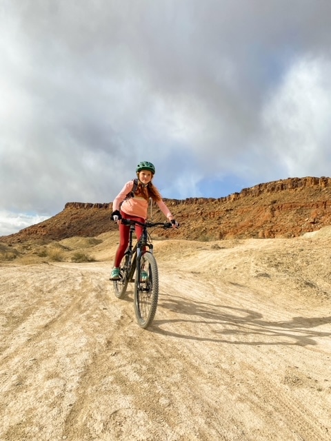 Girl on a mountain bike trail