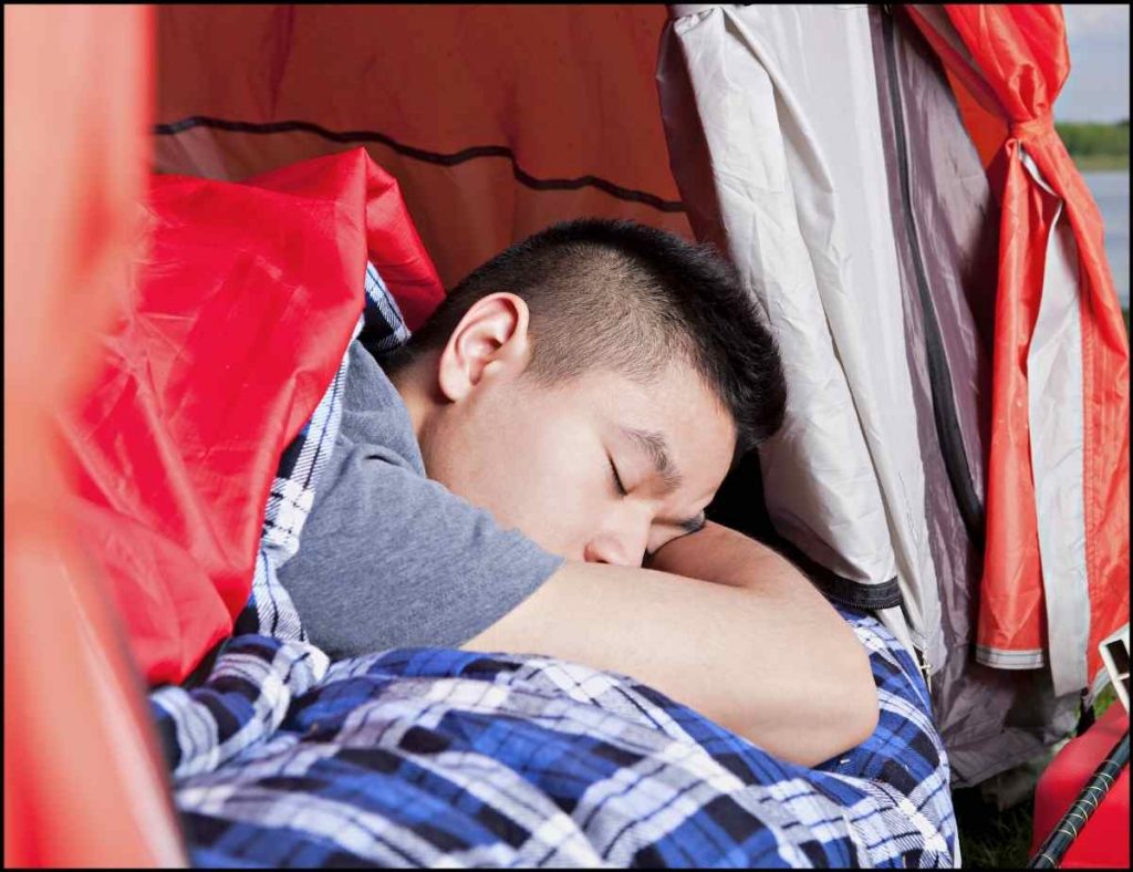 camping in tent sleeping