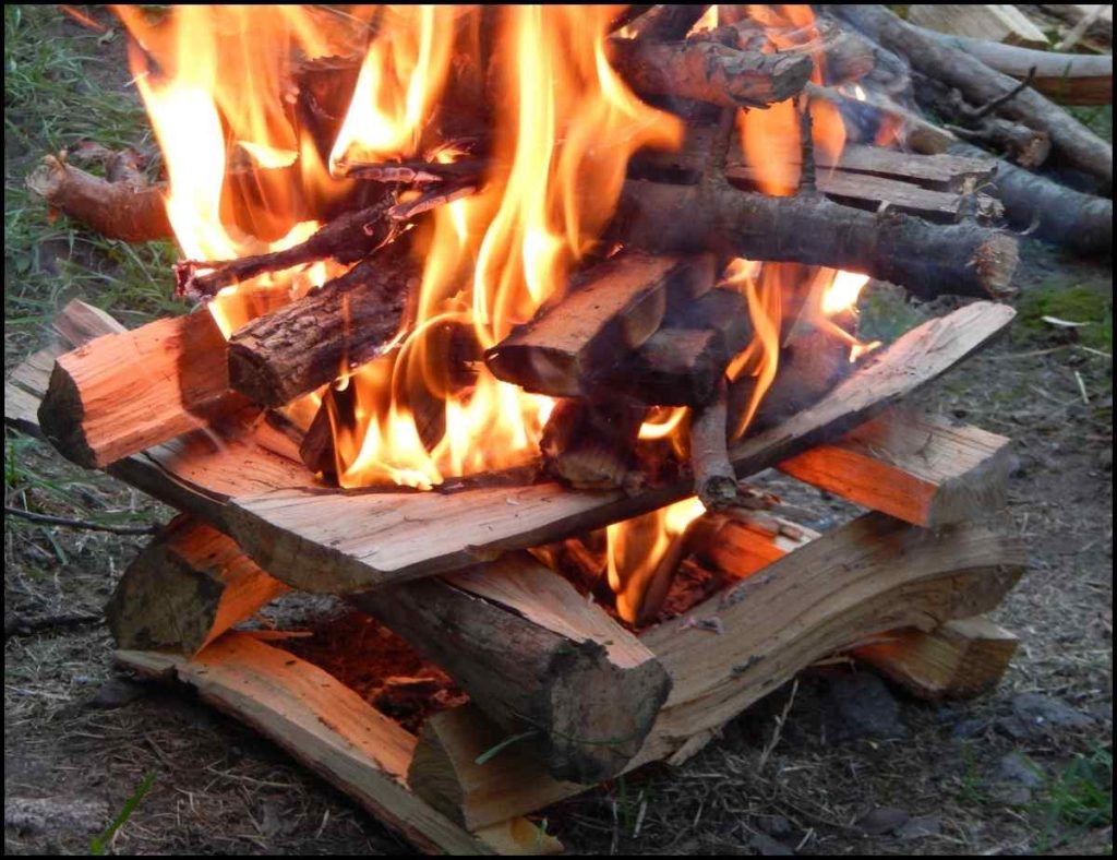 A burning log cabin camp fire